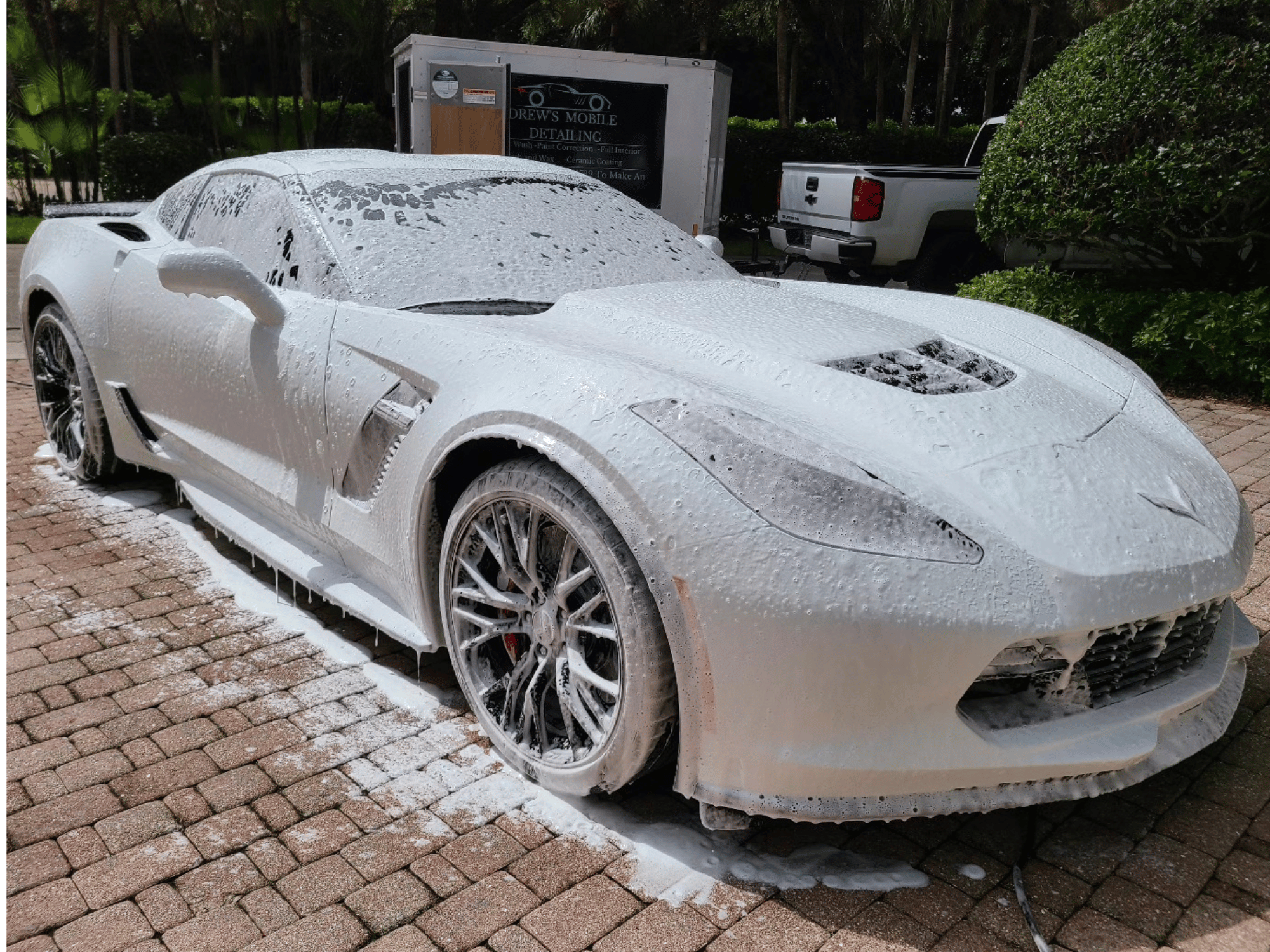 Foam cannon wash detail on white Chevrolet Corvette in Naples Florida