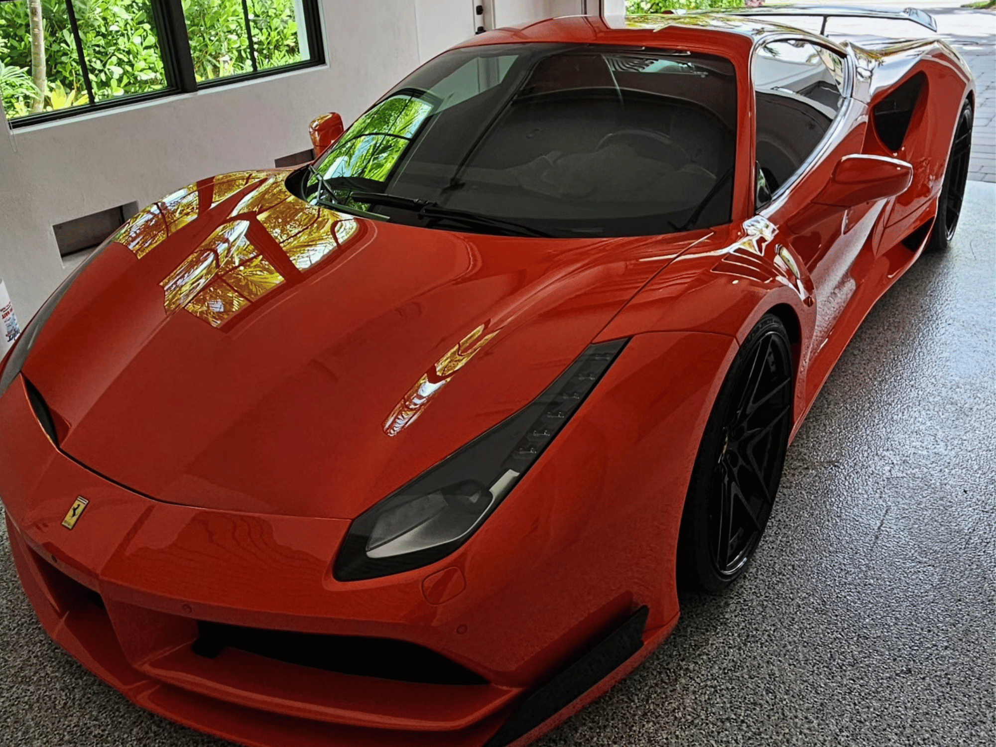 Red Ferrari deep gloss finish detail in Naples Florida