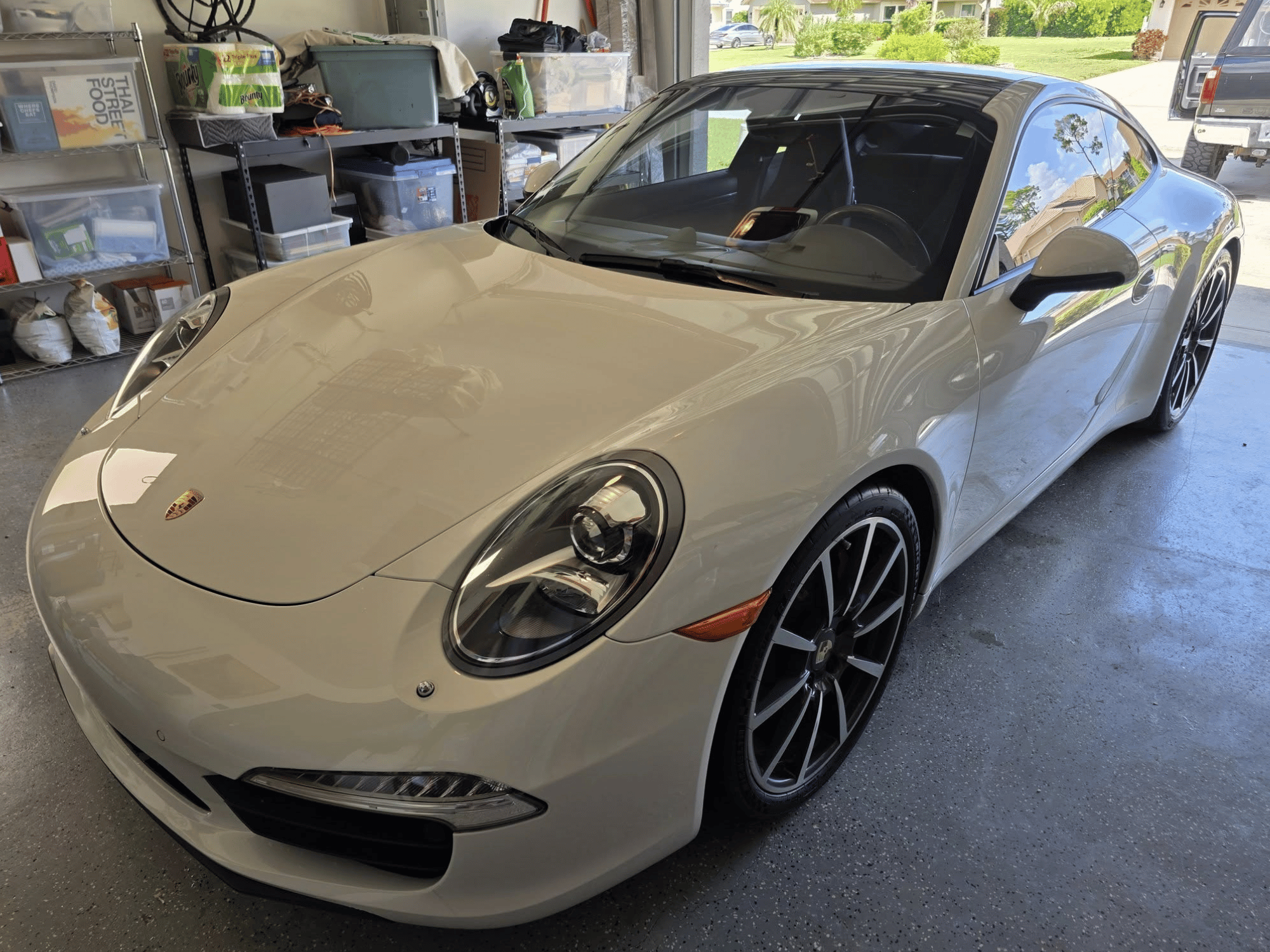 White Porsche coupe detailed inside a Naples Florida garage