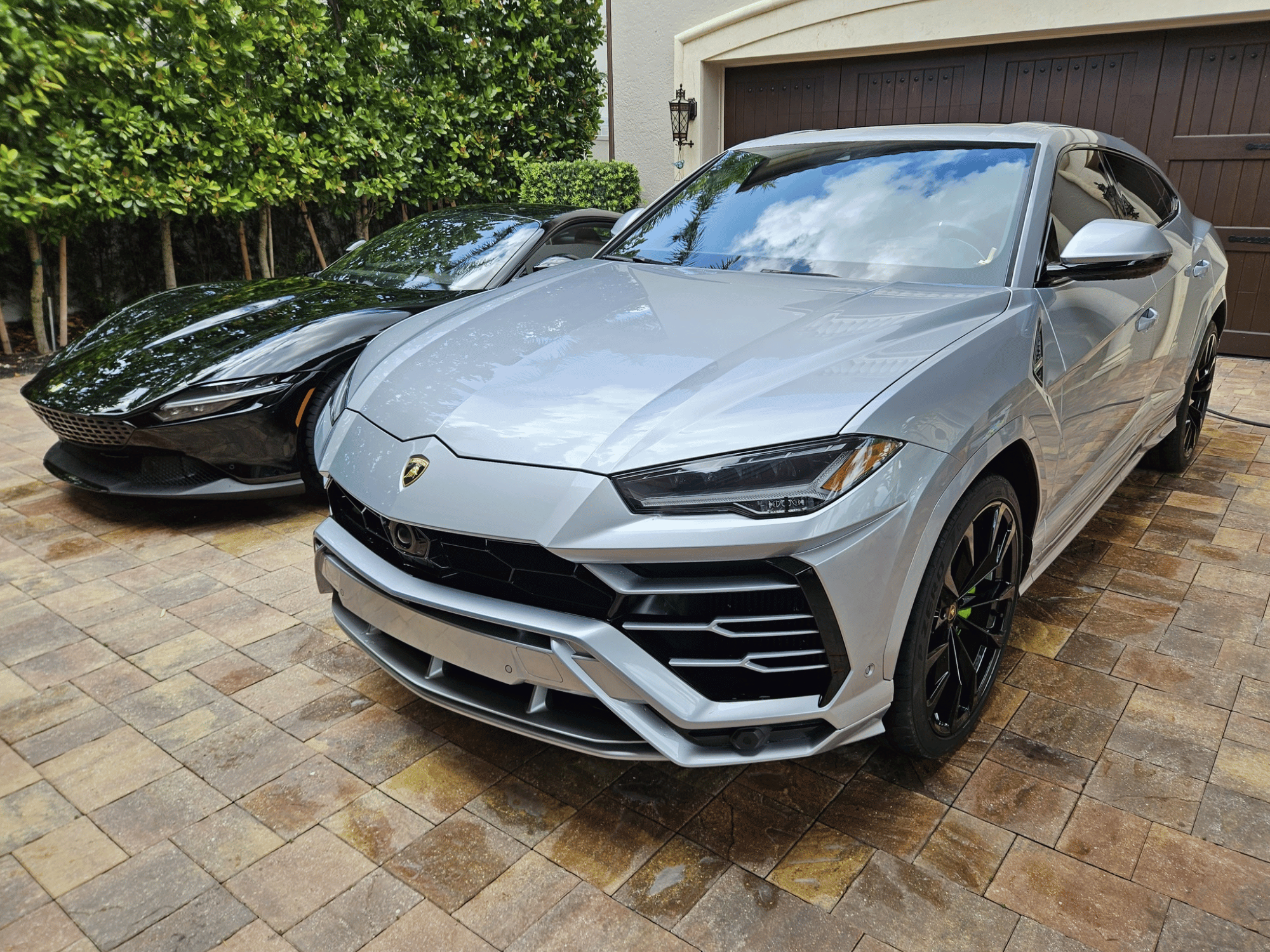 Lamborghini Urus and Ferrari detailed together in Naples Florida
